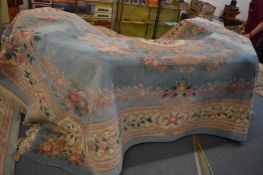 A Chinese pale blue ground carpet with floral decoration, 364cm x 268cm.