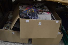 Three large boxes of DVD's.