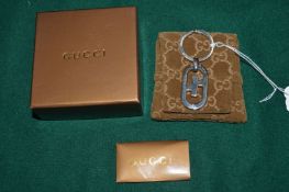 A boxed Gucci key ring.