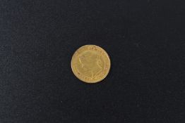 A gold one peso coin, 1863.