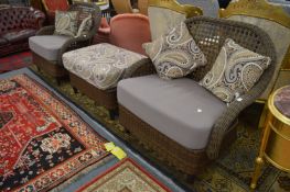 A good modern rattan style suite comprising a pair of small two seater settee's and a large foot