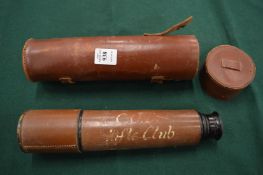 Leather cased telescope.
