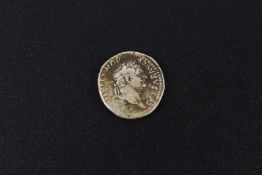 A silver Roman style coin.