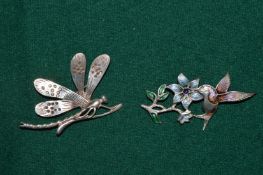 Two brooches.