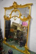 A large and impressive gilt framed over mantel mirror with shell shaped cresting, 230cm high x 182cm