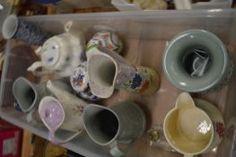 A good collection of pottery jugs, porcelain and assorted china ornaments.