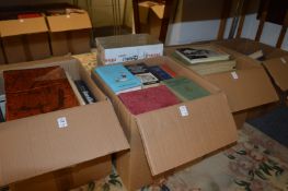 Five boxes of assorted books.