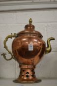 An Eastern copper and brass ewer.