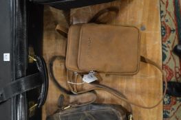 A Stilord small leather double pouch with shoulder strap.