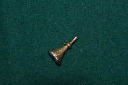 A watch winding gold seal.