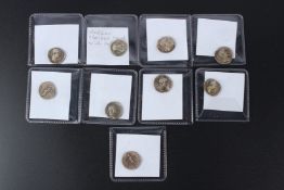 A group of nine silver Roman style coins.