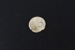 A silver Roman style coin.