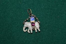 A small enamel elephant pendant.