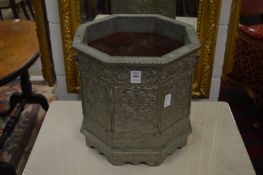 An Eastern embossed white metal mounted octagonal shaped jardiniere.