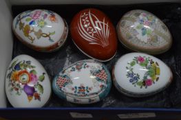 Six Herend porcelain egg shaped trinket boxes and covers.