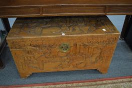 A Chinese carved camphor wood coffer.