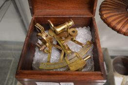 Reproduction brass sextant in a mahogany case.