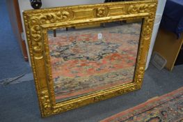Decorative gilt framed rectangular wall mirror.