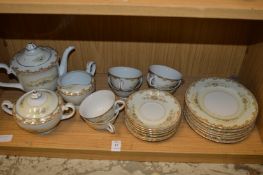A floral decorated porcelain tea service.