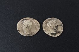 Two silver Roman style coins.