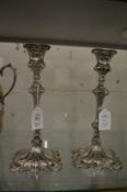 A pair of plated candle sticks.