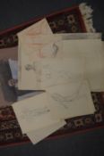 A group of unframed pencil figure studies.