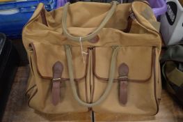 A good canvas and leather holdall.
