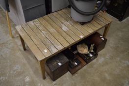 A hardwood garden coffee table.