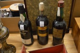 A bottle of Blandys Madeira together with two bottles of wine.