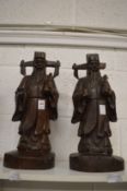 A pair of Chinese carved hardwood figures of immortals.