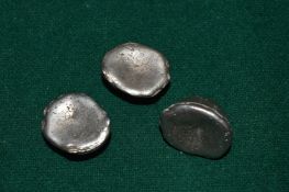 A small collection of Chinese white metal ingots.