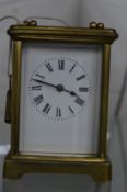 A brass carriage clock.