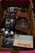 A collection of vintage cameras.