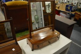 A Georgian mahogany dressing table mirror with drawers to the base.