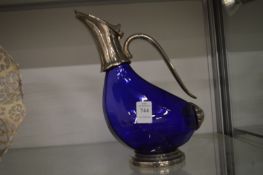 A duck shaped claret jug.