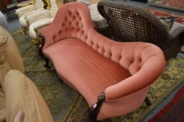 A Victorian carved walnut framed chaise longue.