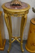 A pair of carved gilt wood tall jardiniere stands with marble inset tops.