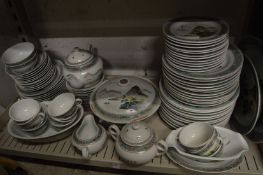 Comprehensive Chinese dinner service painted with a landscape.