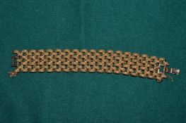 A gilt metal bracelet.