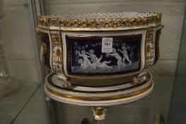 A pair of matching jardinieres on stands.