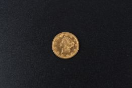 A USA one dollar gold coin.