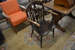 A beech and elm wheelback armchair.