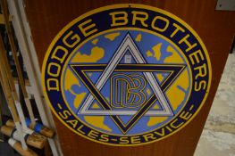 A Dodge Brothers circular enamel sign.