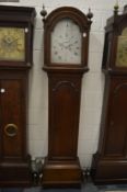 A 19th century oak longcase clock with eight day movement, the silvered arch dial signed Samuel