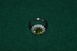 A natural 2ct peridot and silver ring with certificate.