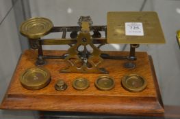A set of postal scales and weights.