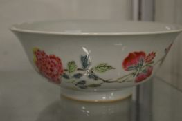 A good Chinese circular bowl painted with flowers, six character mark to the base.