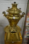 A large brass samovar on tray.