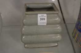 A Chinese celadon glazed square shaped vase with ribbed body.