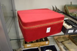 A stylish jewellery case containing designer ear clips and bangles.